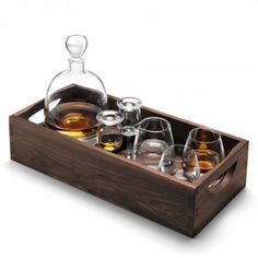 a wooden tray filled with glasses and an empty decanter