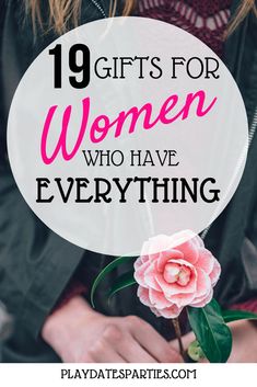 a woman holding a pink flower with the words, gifts for women who have everything