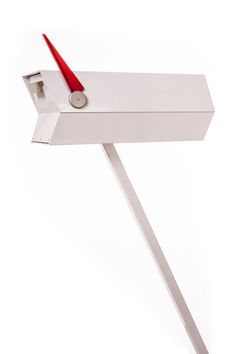 a white desk with a red handle on it