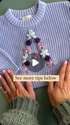 two hands holding onto a sweater with flowers on it and the words see more tips below