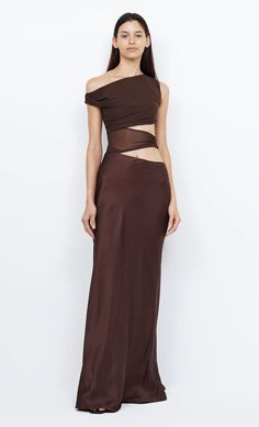 The Ophelia Maxi Dress is an elegant style crafted from a lustrous cocoa fabric featuring a soft mesh bust with an asymmetrical off-shoulder neckline and sheer waist cut outs. The dress is finished with a contrast skirt that falls into a maxi length. FIT: Designed to be fitted at the bust and waist. Maxi dress is accessed through invisible zip at side seam, strapless bra friendly. Fabric offers no stretch to the fit. SIZING: True to size, select your normal size. Model is 180cm / 5’11” wearing A Brown Dresses Formal, Australian Fashion Designers, Glam Dresses, Brown Dress, Unique Dresses, Cut Outs, Elegant Style, Pretty Dresses, Wedding Guest Dress