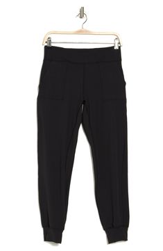 Enjoy a morning stroll in these comfy stretch-knit joggers that inspire you to get moving. 12'' rise, 27'' inseam (size M) Elastic/drawstring waist 2 slant pockets 78% polyester, 22% spandex Machine wash Imported Model stats: 5'10" height, 32" bust, 25" waist, 36" hip. Model is wearing size M. Knit Joggers, Get Moving, Active Wear Pants, Drawstring Waist, Nordstrom Rack, Active Wear, Sweatpants, Nordstrom, Spandex