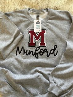 Show off your school pride with our custom embroidered sweatshirts! Perfect for high school and college students, parents, and athletes, these Gildan sweatshirts feature the first letter of your school or college embroidered prominently, with the entire name in eye-catching 3D puff embroidery. FEATURES: *     3D Puff Embroidery: Puff Embroidery: Unique 3D puff technique adds dimension and style to the design. *     High-Quality Fabric: Crafted from a soft and durable cotton-blend fabric, ensuring comfort and longevity. *     Personalization: First letter of your school or college embroidered, with the full name in 3D puff for a standout look. *     Variety of Sizes: Available in a range of sizes from XS to XXL to fit all body types comfortably. *     Unisex Design: A classic and versatile School Sweater Design, Alumni Reunion, Embroidery Unique, Puff Embroidery, School Sweater, School Sweatshirts, Gildan Sweatshirt, College Sweatshirt, School Pride