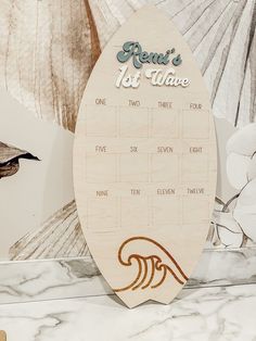 a wooden calendar sitting on top of a counter