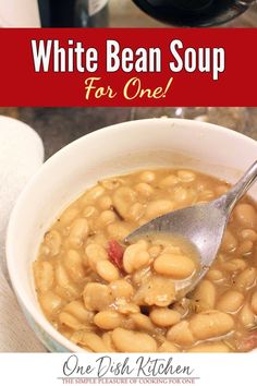 white bean soup for one is in a bowl with a ladle full of beans