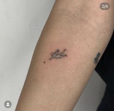 a person with a tattoo on their arm