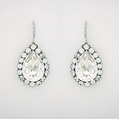 two pairs of earrings with white stones and clear tears on the bottom, set in 18k white gold