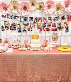 there is a table with pictures and cakes on it