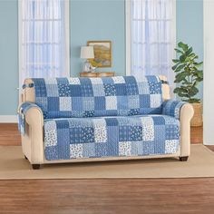 a living room with a couch and rug on the floor