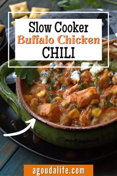 slow cooker buffalo chicken chili recipe on a plate with tortilla chips and cilantro