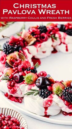 christmas pavlova wreath with raspberry coulie and fresh berries