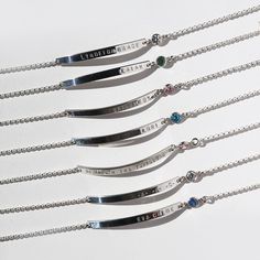 "Our signature personalized, sterling silver birthstone bracelet, features a sparkling birthstone accent, and is the perfect mom, bridesmaid or wedding bracelet. Engrave the front of the nameplate with a name, date, a heart or initials for a stunningly simple piece. Wear as an expression of all that you love.... We use a heavy gauge metal to produce all our nameplates, with our excellent workmanship, we create a high quality look. Each letter is hand stamped using metal letter punches, not machi Classic Sterling Silver Birthstone Bracelets, Classic Silver Bracelets With Birthstone, Classic Silver Birthstone Bracelets, Classic Silver Bracelet With Birthstone, Elegant Hand Stamped Sterling Silver Name Bracelet, Sterling Silver Birthstone Bracelet For Anniversary, Anniversary Sterling Silver Bracelet With Birthstone, Silver Dainty Name Bracelet With Birthstone, Dainty Silver Name Bracelet With Birthstone