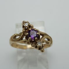 Victorian Amethyst Diamond Ring 14k Gold Size 6 14k Yellow Gold Size 6 can be sized at a low cost  The Ring is 12.5mm across by 4.2mmin Height  Diamond 0.08ct total and Amethyst 0.30ctmm  Comes with a new gift box item # 5826 14k Gold Purple Ring With Diamond Accents, Purple 14k Gold Ring With Diamond Accents, 14k Gold Purple Diamond Ring, Classic Amethyst Diamond Ring In Yellow Gold, Classic Gold Amethyst Diamond Ring, Amethyst Wedding Ring Stamped 14k, Wedding Amethyst Ring Stamped 14k, Wedding Amethyst Ring With Diamond Accents In 14k Gold, 14k Gold Amethyst Ring With Diamond Accents For Wedding