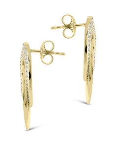 Make a statement with the exquisite Adelina Linking Drop Studs. These drop earrings feature CZ stones that glimmer with sophistication, perfect for adding a touch of luxury to any look. Exude elegance and make your mark with Adelina. Material: 14K gold or rhodium plated brass, cubic zirconia Features: 1" drop, 0.75" width, 1mm CZ stones, Lead & Nickel free, post back Elegant Gold Cluster Earrings With Pave Setting, Dazzling Bridal Earrings With Pave Setting For Evening, Modern Gold Earrings With Pave Setting, Dazzling Diamond Earrings With Pave Setting For Party, Round Earrings With Pave Setting For Party, Modern Gold Earrings With Sparkling Stones, Round Party Earrings With Pave Setting, Modern Sparkling Earrings For Formal Occasions, Modern Sparkling Formal Earrings