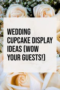 wedding cupcake display idea with white roses and baby's breath in the background