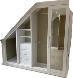 an attic style closet with mirrored doors and shelves