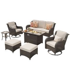 an outdoor patio furniture set with cushions and chairs, including a coffee table and ottoman