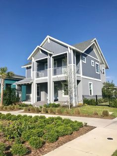 the front of a two story house with landscaping