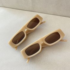 BEIGE  Micro Rectangle Sunglasses featuring a straight upper bridge. Sample / Great condition / Never worn / One off design.  Gold Shevoke branding inside arm frame 100% UV Protection High Sun Glare Reduction Acetate Frame Lens Height: 26mm, Lens Width: 455mm, Sunglass Length: 135mm Arm thickness: 25mm Modern Beige Rectangular Sunglasses, Casual Beige Rectangular Sunglasses, Trendy Beige Rectangular Sunglasses, Beige Rectangular Sunglasses With Uv Protection, Brown Rectangular Plastic Sunglasses, Small Glasses, Chic Sunglasses, Tortoise Shell Sunglasses, Rectangle Sunglasses