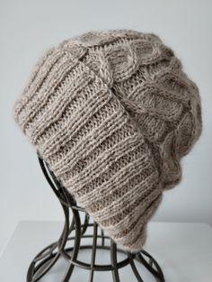 * Handed knitted winter hat/ beanie for women using wool, mohair and    polyamide blend yarn that will keep you warm and cozy during the colder   months * It is soft and warm without the chunky feeling * Color : Beige * Pamper yourself and for sure it will make a perfect gift * Materials : 1 strand of 65% Wool, 35 % Alpaca blend wool + I strand of 60%    Mohair, 20% Alpaca,20% polyamide yarn to give it's unique color and softness * Size : Fit head size 56-58cm * Height with brim folded : ~ 23cm  * Width of brim : ~ 22cm * Color may look different due to lighting, computer monitors and cell phone    screens * Hand wash in 30C and dry flat. Don't use fabric softener  * Due to the nature of Mohair, slight shedding may sometimes occur * Due to hygienic reasons, returns and exchanges can't be o Hat With Pom Pom, Winter Beanie Hat, Beanie Hats For Women, Phone Screens, Winter Hats Beanie, Hat Beanie, Hat For Women, Winter Beanie, Pom Pom Hat