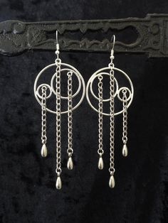 "These modern statement earrings are pretty unique and full of movement due to their asymmetric design. But they are lightweight for their size and you'll be able to dress them up and down for all kinds of occasions and styles. The bronze color version of this design featured in Photo 9 is available here: https://www.etsy.com/listing/192957222 MEASUREMENTS: 4 1/16\" (10.3 cm) long (from top of the hook down), 1 5/16\" (3.3 cm) wide WEIGHT: 6 g (0.21 oz) each The earrings come with your choice of Chic Metal Long Drop Linear Earrings, Chic Long Drop Metal Linear Earrings, Chic Metal Linear Long Drop Earrings, Trendy Nickel Free Metal Chandelier Earrings, Trendy Nickel-free Metal Chandelier Earrings, Metal Chandelier Drop Earrings, Modern Metal Long Drop Linear Earrings, Trendy Metal Linear Earrings With Ear Wire, Modern Metal Linear Earrings For Evening