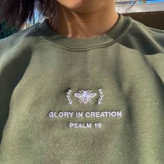 *SIZES ARE UNISEX* -I'd suggest your usual size for a more fitted look, or sizing up for a more relaxed fit. *these sweatshirts are extra comfy when oversized 🐝 "Glory in Creation Psalm 19" embroidered on a comfy cute crewneck. A sturdy and warm sweatshirt bound to keep you warm in the colder months. A pre-shrunk, classic fit sweater that's made with air-jet spun yarn for a soft feel and reduced pilling. Your new favorite sweatshirt! * 50% cotton, 50% polyester * Pre-shrunk * Classic fit with n Spring Sweater With Embroidered Logo For Streetwear, Spring Streetwear Sweater With Embroidered Logo, Spring Crew Neck Sweater With Embroidered Logo, Spring Crew Sweatshirt With Embroidered Logo, Spring Sweatshirt With Embroidered Logo And Crew Neck, Spring Crew Neck Sweatshirt With Embroidered Logo, Spring Crew Sweatshirt With Embroidered Text, Fall Streetwear Sweatshirt With Embroidered Text, Crew Neck Sweater With Embroidered Text For Streetwear