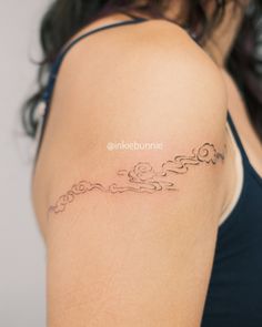 a woman with a tattoo on her arm