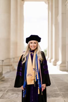 a woman in a graduation gown and cap