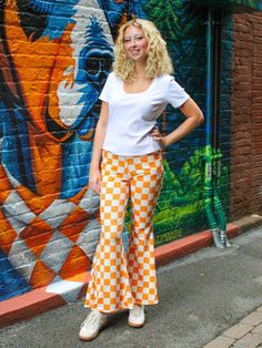 Look your best with these TN Checkerboard Pants. Crafted with a unique orange and white checkered pattern, they feature a flared design for an eye-catching look. The perfect pants for gameday! Checkerboard Pants, Go Vols, Checkered Pants, In My Feelings, Perfect Pant, Tier Skirt, Checkered Pattern, White Trim, Soft Velvet