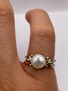 Vintage white cultured pearl  Sterling silver with gold setting   Re sizing has a $20 jeweler's fee. All rings are shipped in a nice gift box.   Check out our over a THOUSAND great reviews Engraving is $4 per letter and is not always perfect depending on the piece. It can take a few days if the jeweler is busy. This is payable to Paypal Judithsltd@gmail.com White Pearl Drop Ring For Anniversary, White 14k Oval Pearl Ring, Fine Jewelry White Pearl Ring Stamped 14k, White Pearl Ring Stamped 14k, White Pearl Ring Stamped 925 As Gift, Classic Formal Jewelry With Hallmark, Classic White Gold Jewelry With Hallmark, 14k Stamped Pearl Ring As Gift, Gold Sterling Silver Pearl Ring For Formal Occasions