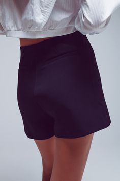 Introducing our stylish and versatile Wrap Mini Skort in elegant Black. This unique piece combines the comfort of shorts with the chic appearance of a wrap skirt, creating a perfect balance between fashion and functionality. Crafted from a lightweight and comfortable blend of 95% polyester and 5% elastane, this skort ensures ease of movement and a flattering fit. The lining is made of 100% polyester, adding an extra layer of comfort. Our model, standing at 6" with measurements 31-22-35, is weari Mini Short, Modern Trend, Perfect Wardrobe, Fit Style, The Chic, Fast Fashion, Dresses With Leggings, Casual Wardrobe, Black Fabric