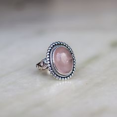 Natural Rose Quartz 925 Sterling Silver Designer Ring Handmade Ring Statement Ring Boho Ring Rose Quartz Ring Anniversary ring, Gift For Her ❥ Product Description ❥ Metal: Solid sterling silver ❥ Stone Size: 10*14 MM Oval ✈ Free Shipping (USPS) ✈ Free Shipping to the United Kingdom 🎁 Free Gift Box ↻ 3 Days Return ⌛ 3 Day Handling Time ❥ General Care Instructions Remove jewelry when showering or bathing. This is particularly important when on the beach, in the sea, and chlorinated water Avoid wearing jewelry when doing physical work such as housekeeping, gardening, or exercise Never expose jewelry to household cleaning products, especially bleach and highly reactive solutions Avoid spraying perfume, or hairspray on the gemstones or pearls as it jeopardizes the integrity of the material Rem Rose Quartz Ring, Boho Ring, Quartz Rose, Quartz Ring, Anniversary Ring, Boho Rings, Ring Handmade, Piercing Jewelry, Statement Ring