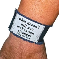 Kelly Clarkson Lyrics, Fabric Cuff Bracelet "What Doesn't Kill You Makes You Stronger" Handmade Pop Music Jewelry For Women Thoughtful & Personalized Gift ***Adjustable, Durable & Possibly The Most Comfortable Bracelet Eva! Layers Of Upcycled Navy Blue, Cotton Fabric Stitched Together Text Is Heat Set & Water Resistant Frayed Edges Distressed, Grunge Vibes Cleans Easily W Wet One Or Machine Wash Closes W A Vintage Blue Button And Stretch Loop 6 1/2"L 1 1/4"W Fits Wrist Up To 7 1/2" I Take Great Trendy Adjustable Blue Cuff Bracelet, Adjustable Blue Cuff Bracelet, Blue Adjustable Unique Cuff Bracelet, Adjustable Beaded Blue Cuff Bracelet, Handmade Bohemian Blue Cuff Bracelet, Kelly Clarkson Lyrics, Vintage Blue Cuff Bracelet, Fabric Cuff Bracelet, Grunge Vibes