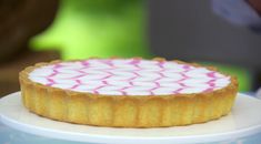 a small cake sitting on top of a white plate