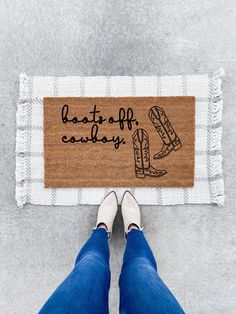 a person standing in front of a door mat with the words beat to off cavalry on it