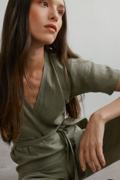 "AURORA is a short sleeve jumpsuit with belt. DETAILS - Wrap style top - Dolman sleeves - Self tie belt - Zip closure at the back - 100% lightweight European linen fabric - Cut and sewn to order just for you in our studio COLOR - Sage Green, you can also choose other colors above - Fabric samples are available here https://www.etsy.com/listing/586569696/linen-fabric-samples SIZING & FIT - Fits true to size - Model is 5'9.5\" / 177cm and wearing a size XS Tall CARE FOR LINEN - Machine wash up to 30ºC/86ºF gentle cycle - Lay flat to dry or tumble dry low - Warm iron if needed - Do not bleach SIZE GUIDE Size conversion guide Size XS (US 0-2, IT 36-38, UK 4-6, Japan 3-5, France 32-34) Size S (US 4-6, IT 40-42, UK 8-10, Japan 7-9, France 36-38) Size M (US 8-10, IT 44-46, UK 12-14, Japan 11-13, Green Short Sleeve Jumpsuits And Rompers, Short Sleeve Belted Jumpsuits And Rompers For Work, Belted Short Sleeve Jumpsuits For Work, Belted Short Sleeve Jumpsuits And Rompers For Work, Green Belted Jumpsuits And Rompers For Summer, Summer Green Belted Jumpsuits And Rompers, Summer Wrap Jumpsuits And Rompers With Tie Waist, Fitted Short Sleeve Jumpsuit With Tie Waist, Green Short Sleeve Jumpsuits And Rompers For Work