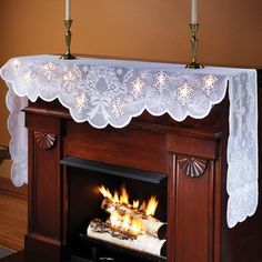 an image of a fireplace with a white lace over it