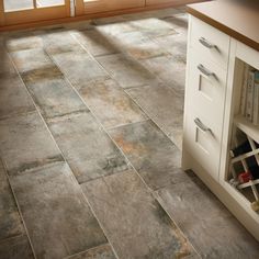 the kitchen floor is clean and ready to be used as a wine rack for bottles