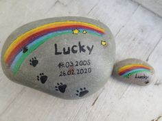 two rocks with the names lucky and rainbow painted on them