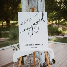 an easel with a sign that says we're engaged