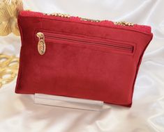 This clutch features classic sophistication and sparkle, with intricate beading and motifs, making for an ideal evening accessory. Roomy enough to fit all large-screen smartphones. Included is an extended chain for your convenience. Zip pocket on the back Color: Red & Gold Front flap magnet closure Elegant Red Evening Bag For Mobile Phone, Elegant Red Beaded Clutch, Evening Accessories, Intricate Beading, Gold Fronts, Red Pearl, Handmade Clutch, Designer Clutch, Beaded Clutch