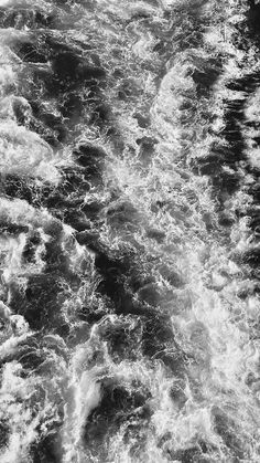 black and white photo of water with small waves