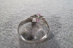 I am offering you this vintage sterling silver (stamped) ruby band ring. It features an oval shaped prong set genuine ruby stone. It is currently a size 9, though I am sure this could easily be sized up or down. It measures approx. 3/4 inch, by app 1/4 inch, and weighs 4 grams. This is a must have to add this to your jewelry collection. Buyer pays shipping and handling. Silver Ruby Ring With Three Stones In Oval Shape, Vintage Oval Three-stone Ruby Ring, Vintage Oval Ruby Ring With Accent Stones, Collectible Oval Ruby Ring In Silver, Silver Three-stone Ruby Ring, Vintage Ruby Ring With Accent Stones For Anniversary, Vintage Three Stone Ruby Promise Ring, Formal Silver Ruby Ring With Three Stones, Silver Ruby Ring With Three Stones