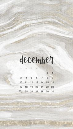 a calendar with the word december written in black and white ink on marbled paper