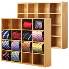 two wooden shelves filled with ties on top of each other