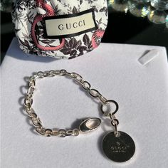 Absolutely Gorgeous Chain Bracelet With Stunning Gucci Pendant On Heavy Strong 925 Silver Great Gift Come With Beautiful Snack Original Dust Bag And Card New Elegant Silver Bracelet With Logo Charm, Luxury Gucci Silver Chain Jewelry, Designer Silver Bracelets With Logo Charm, Gucci Sterling Silver Chain Jewelry, Gucci Silver Chain Jewelry As A Gift, Classic Gucci Jewelry With Silver-tone Logo Plaque, Gucci Sterling Silver Bracelet, Luxury Gucci Chain Bracelet As Gift, Luxury Gucci Chain Bracelet