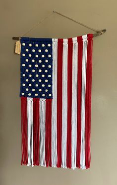 an american flag hanging on a wall