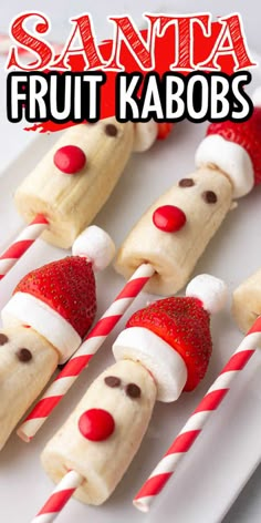 santa fruit kabobs on a white plate with candy canes