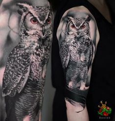 an arm with two owls on it and one is black and white, while the other has red eyes