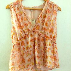 Lucky Brand Sleeveless Blouse V-neck Vest Blouse For Day Out, Sleeveless Vest Blouse For Summer, Summer Blouse With V-neck And Vest Detail, Sleeveless Floral Print Blouse For Beach, Summer Feminine V-neck Vest, Feminine V-neck Vest For Summer, Bohemian Sleeveless Blouse With Floral Print, Chic Cami Blouse With Floral Print, Chic Floral Print Cami Blouse